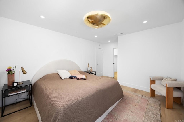 11741 Foster Rd, Los Alamitos, CA 90720 - bedroom featuring light wood-type flooring and recessed lighting