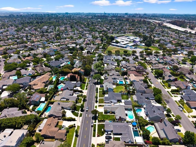 11741 Foster Rd, Los Alamitos, CA 90720 - aerial overview of property's location with a pool and nearby suburban area