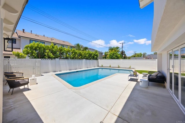 11741 Foster Rd, Los Alamitos, CA 90720 - view of pool featuring a patio area and a fenced backyard