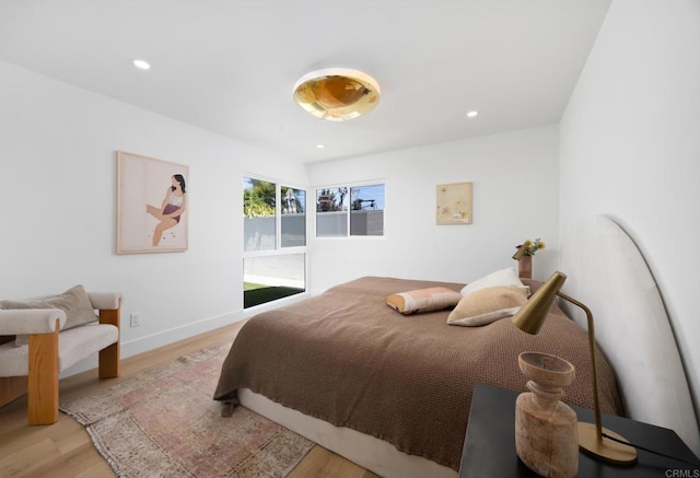 11741 Foster Rd, Los Alamitos, CA 90720 - bedroom featuring wood finished floors and recessed lighting