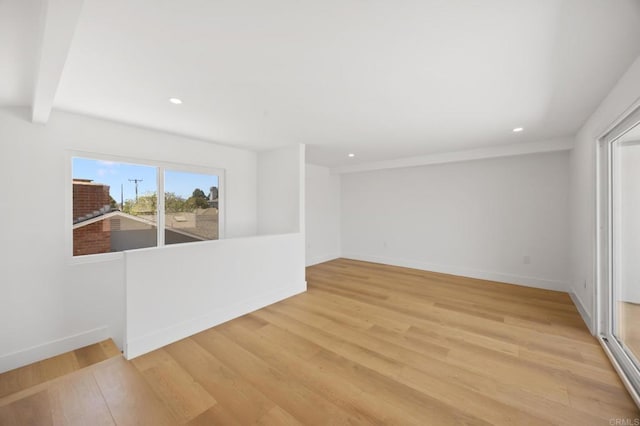 11741 Foster Rd, Los Alamitos, CA 90720 - empty room featuring wood finished floors, recessed lighting, and beam ceiling