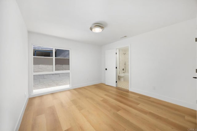 11741 Foster Rd, Los Alamitos, CA 90720 - spare room featuring light wood-style floors and baseboards