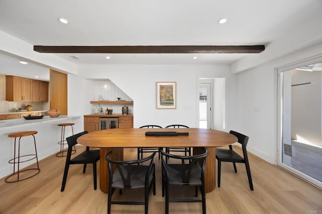 11741 Foster Rd, Los Alamitos, CA 90720 - dining area featuring beamed ceiling, light wood finished floors, recessed lighting, and wine cooler