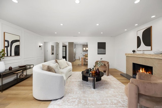19222 S Grandee Ave, Carson, CA 90746 - living room with recessed lighting, light wood-style floors, and a high end fireplace