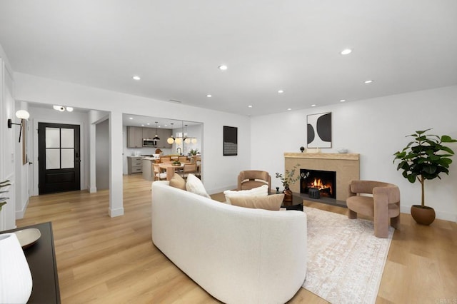 19222 S Grandee Ave, Carson, CA 90746 - living room with a premium fireplace, light wood-style floors, and recessed lighting