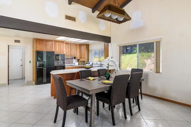 10665 Loire Ave, San Diego, CA 92131 - dining space featuring beamed ceiling, light tile patterned flooring, and high vaulted ceiling