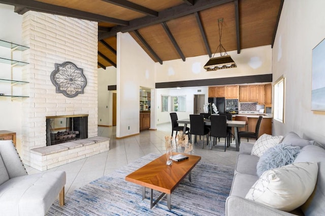 10665 Loire Ave, San Diego, CA 92131 - living area with high vaulted ceiling, light tile patterned flooring, a fireplace, and a wood ceiling with exposed beams