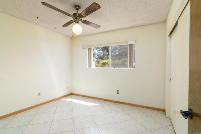 10665 Loire Ave, San Diego, CA 92131 - spare room with a textured ceiling, a ceiling fan, and light tile patterned floors