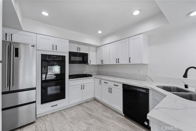 20 Mayapple Way, Irvine, CA 92612 - kitchen with black appliances, white cabinets, light stone countertops, recessed lighting, and light marble finish flooring