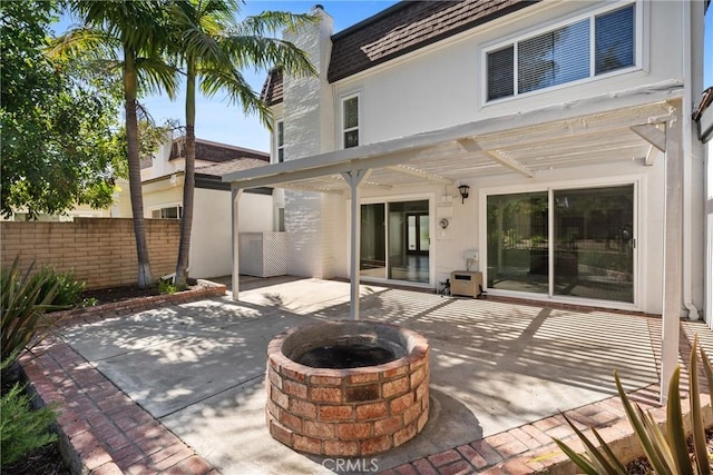 20 Mayapple Way, Irvine, CA 92612 - rear view of property with an outdoor fire pit, a patio, stucco siding, and mansard roof