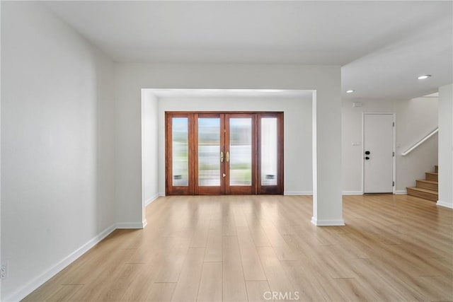 20 Mayapple Way, Irvine, CA 92612 - unfurnished room featuring french doors, stairs, light wood finished floors, and recessed lighting