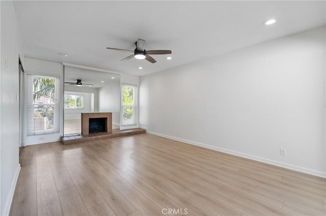 20 Mayapple Way, Irvine, CA 92612 - unfurnished living room featuring a ceiling fan, light wood-style floors, recessed lighting, and a fireplace
