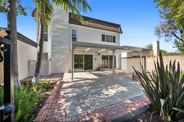 20 Mayapple Way, Irvine, CA 92612 - back of property with stucco siding and a patio