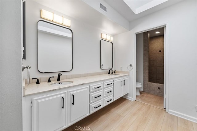 20 Mayapple Way, Irvine, CA 92612 - bathroom featuring double vanity and wood finished floors