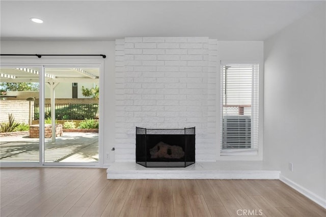 20 Mayapple Way, Irvine, CA 92612 - unfurnished living room with a fireplace, wood finished floors, and recessed lighting