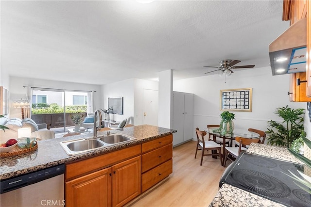 21951 Rimhurst Dr Unit F201, Lake Forest, CA 92630 - kitchen featuring dishwasher, light wood-style floors, open floor plan, a ceiling fan, and brown cabinetry