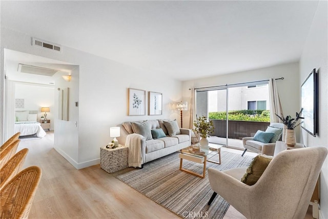 21951 Rimhurst Dr Unit F201, Lake Forest, CA 92630 - living room featuring light wood-style floors and baseboards