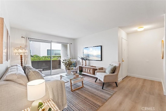 21951 Rimhurst Dr Unit F201, Lake Forest, CA 92630 - living area with light wood-style floors and baseboards