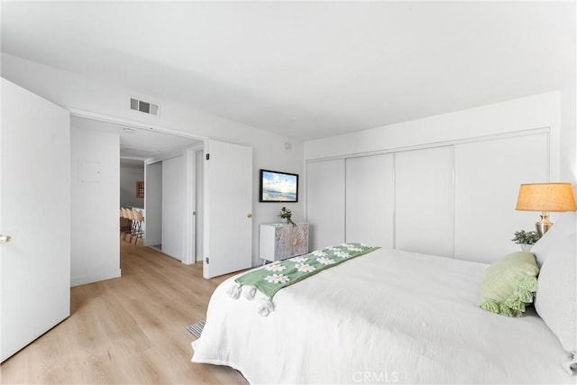 21951 Rimhurst Dr Unit F201, Lake Forest, CA 92630 - bedroom featuring light wood-type flooring and a closet