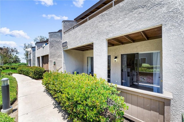 21951 Rimhurst Dr Unit F201, Lake Forest, CA 92630 - doorway to property with stucco siding