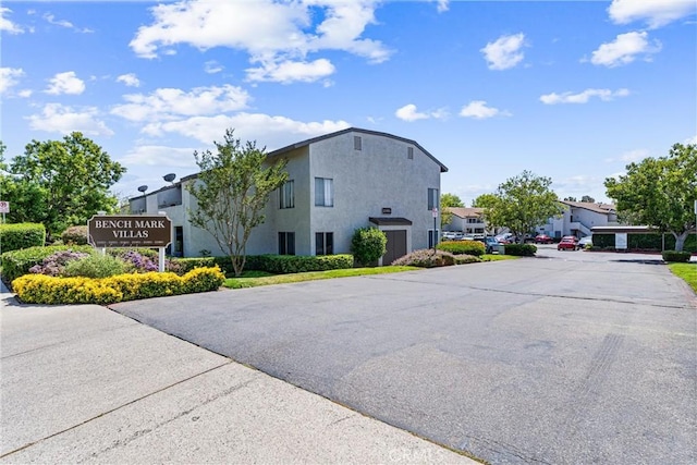 21951 Rimhurst Dr Unit F201, Lake Forest, CA 92630 - exterior space featuring a residential view and stucco siding