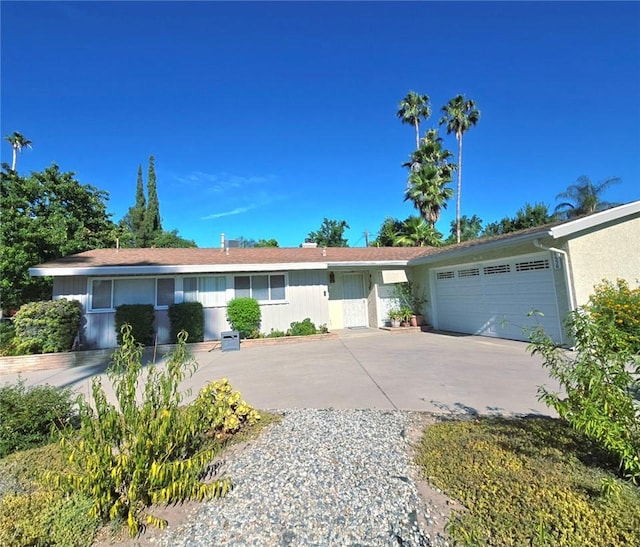 8450 Limerick Ave, Winnetka, CA 91306 - single story home with concrete driveway and a garage