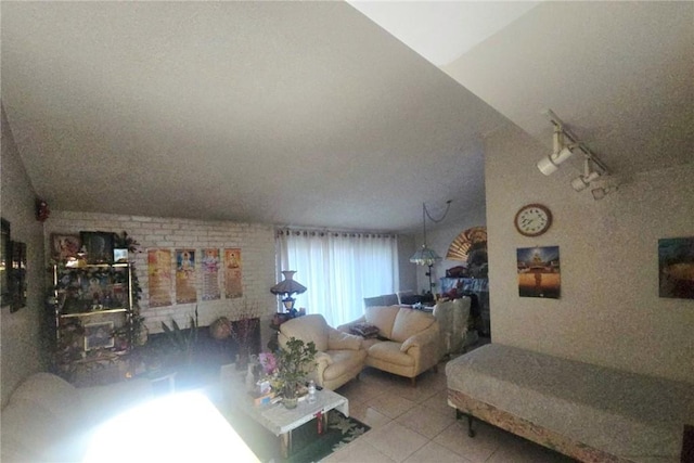 8450 Limerick Ave, Winnetka, CA 91306 - tiled living room with track lighting and vaulted ceiling