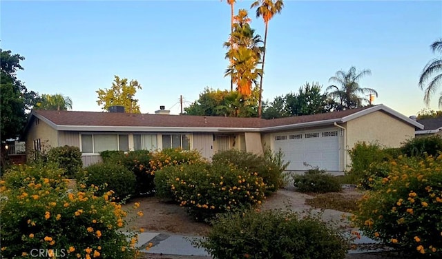 8450 Limerick Ave, Winnetka, CA 91306 - ranch-style house featuring a garage and a chimney