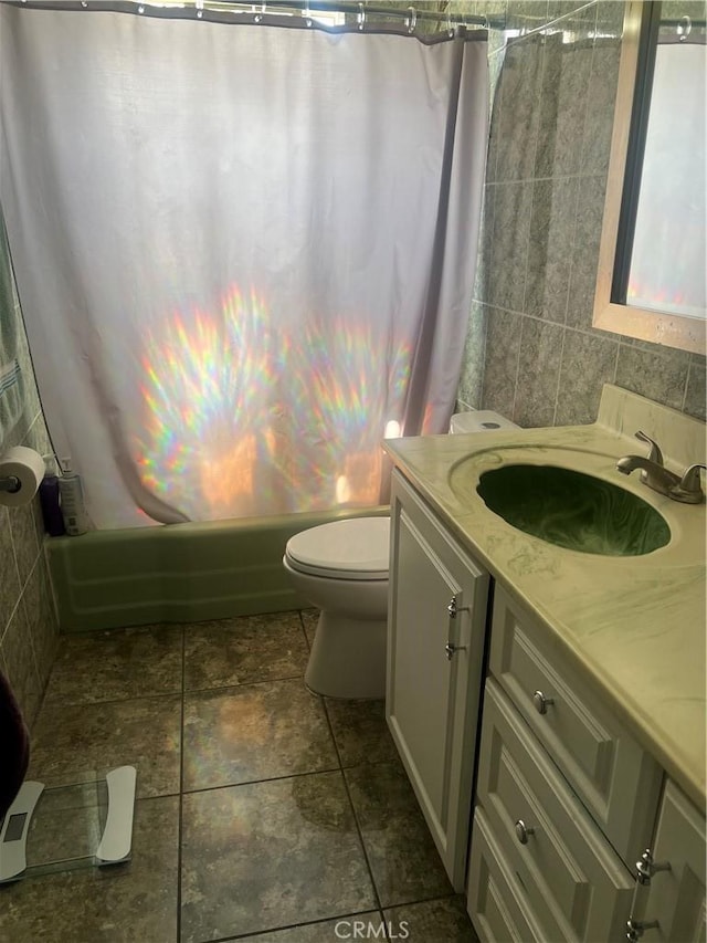 26832 6th St, Highland, CA 92346 - bathroom with vanity, shower / bath combo, and stone finish floors