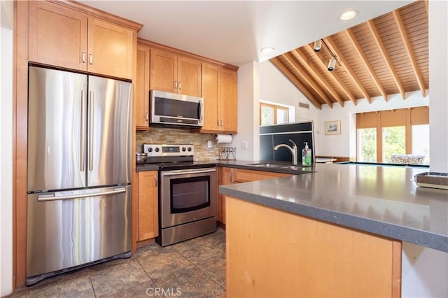 7205 Summertime Ln, Culver City, CA 90230 - kitchen featuring stainless steel appliances, wooden ceiling, backsplash, dark countertops, and a peninsula