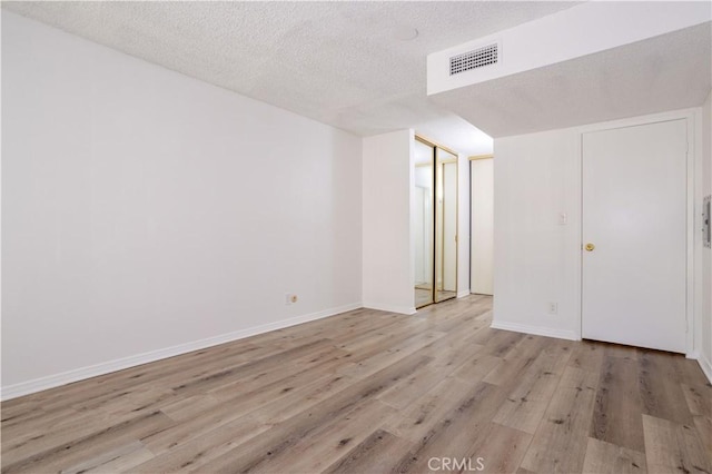 7205 Summertime Ln, Culver City, CA 90230 - unfurnished bedroom featuring wood finished floors and a textured ceiling