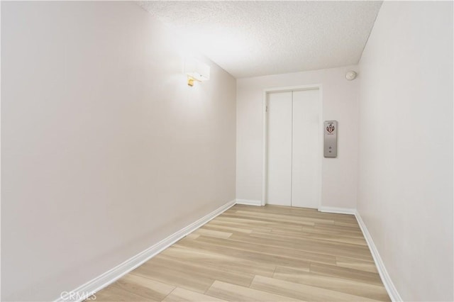 7205 Summertime Ln, Culver City, CA 90230 - spare room with a textured ceiling, light wood-style flooring, and a smoke detector