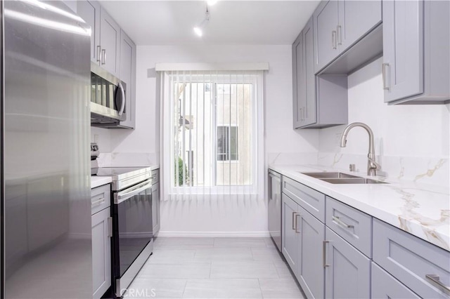 7205 Summertime Ln, Culver City, CA 90230 - kitchen with stainless steel appliances, gray cabinets, and track lighting