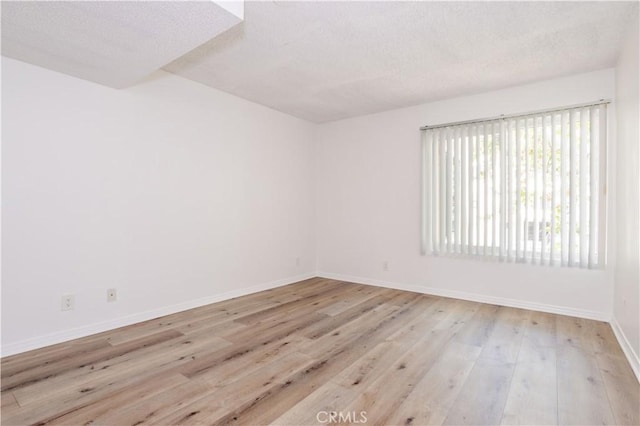 7205 Summertime Ln, Culver City, CA 90230 - unfurnished room with a textured ceiling and wood finished floors
