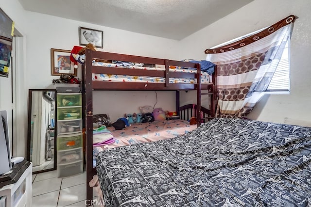1270 S Hicks Ave, Los Angeles, CA 90023 - bedroom featuring tile patterned flooring and a textured ceiling
