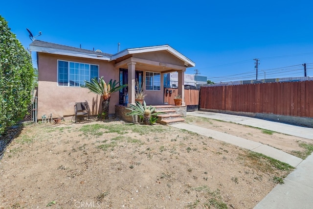 1270 S Hicks Ave, Los Angeles, CA 90023 - view of front facade featuring stucco siding and a porch