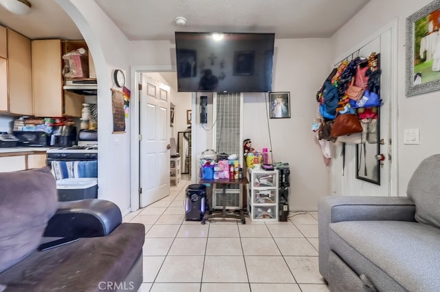 1270 S Hicks Ave, Los Angeles, CA 90023 - living area featuring light tile patterned flooring and arched walkways