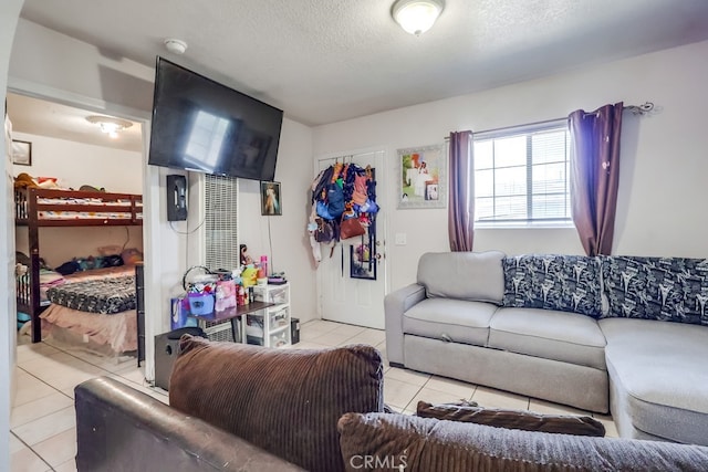 1270 S Hicks Ave, Los Angeles, CA 90023 - living area with light tile patterned floors and a textured ceiling