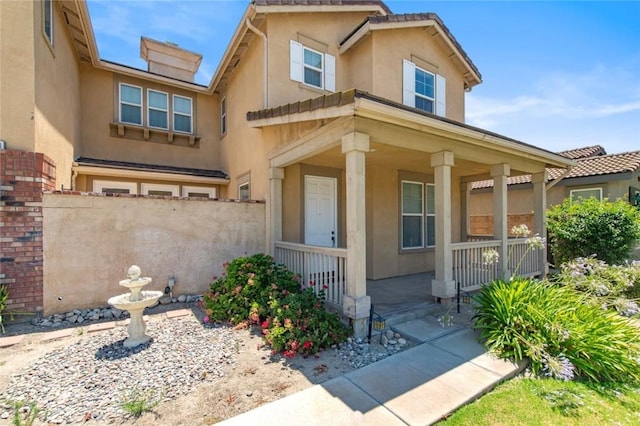6330 La Mesa St, Eastvale, CA 92880 - view of front of home with covered porch and stucco siding