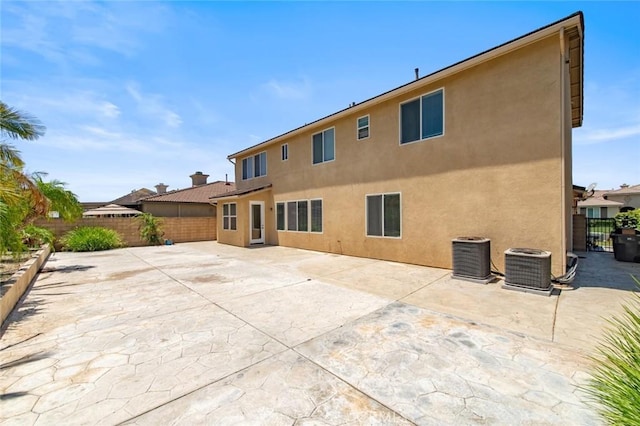 6330 La Mesa St, Eastvale, CA 92880 - rear view of house featuring a fenced backyard, stucco siding, and a patio