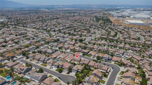 6330 La Mesa St, Eastvale, CA 92880 - aerial view of property and surrounding area with a mountainous background and nearby suburban area
