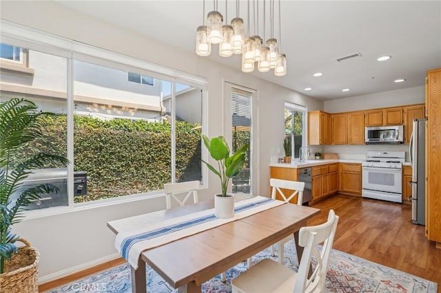 1757 Pierce Ln, Placentia, CA 92870 - dining area with healthy amount of natural light, light wood-style floors, recessed lighting, and a chandelier
