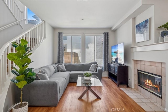 1757 Pierce Ln, Placentia, CA 92870 - living room with light wood-style floors, a tile fireplace, and stairway