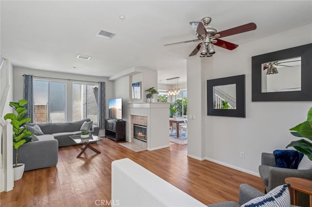 1757 Pierce Ln, Placentia, CA 92870 - living area featuring wood finished floors, ceiling fan, and a tile fireplace