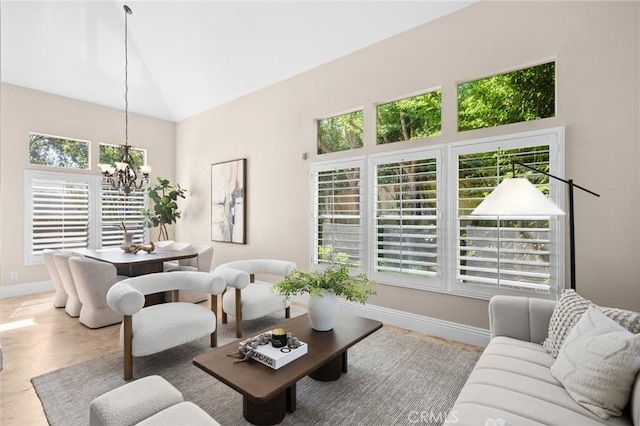 61 Clermont, Newport Coast, CA 92657 - living room with a chandelier and high vaulted ceiling