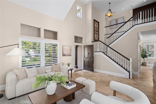 61 Clermont, Newport Coast, CA 92657 - living area featuring a high ceiling, stairs, plenty of natural light, and recessed lighting