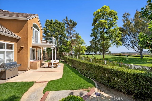 61 Clermont, Newport Coast, CA 92657 - view of green lawn featuring a patio and a balcony