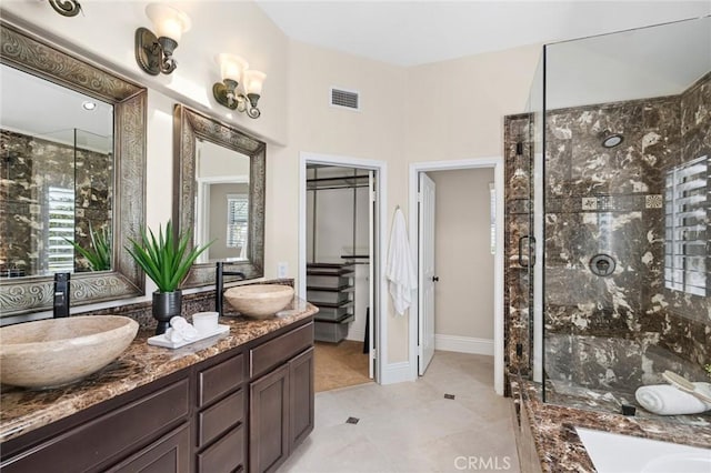 61 Clermont, Newport Coast, CA 92657 - bathroom featuring double vanity, a shower stall, and plenty of natural light