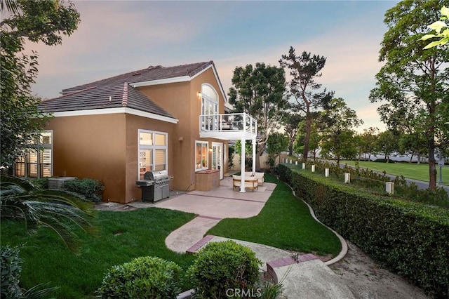 61 Clermont, Newport Coast, CA 92657 - back of house with a balcony, a patio, stucco siding, and a tiled roof