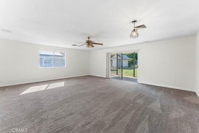 21999 Riverside Ave, Red Bluff, CA 96080 - carpeted empty room featuring plenty of natural light and a ceiling fan